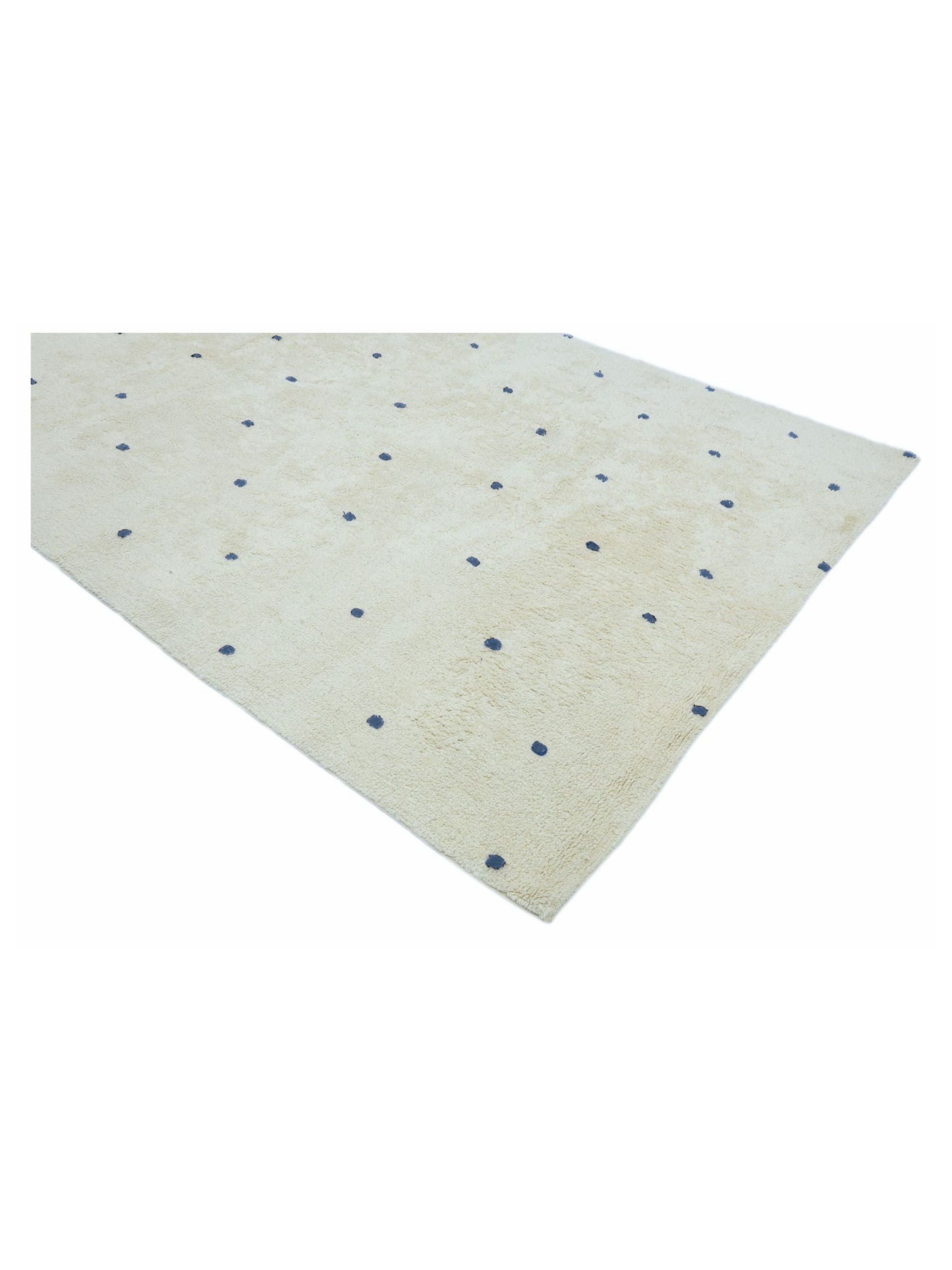 Natural rug with dusty blue polka dots on a white background