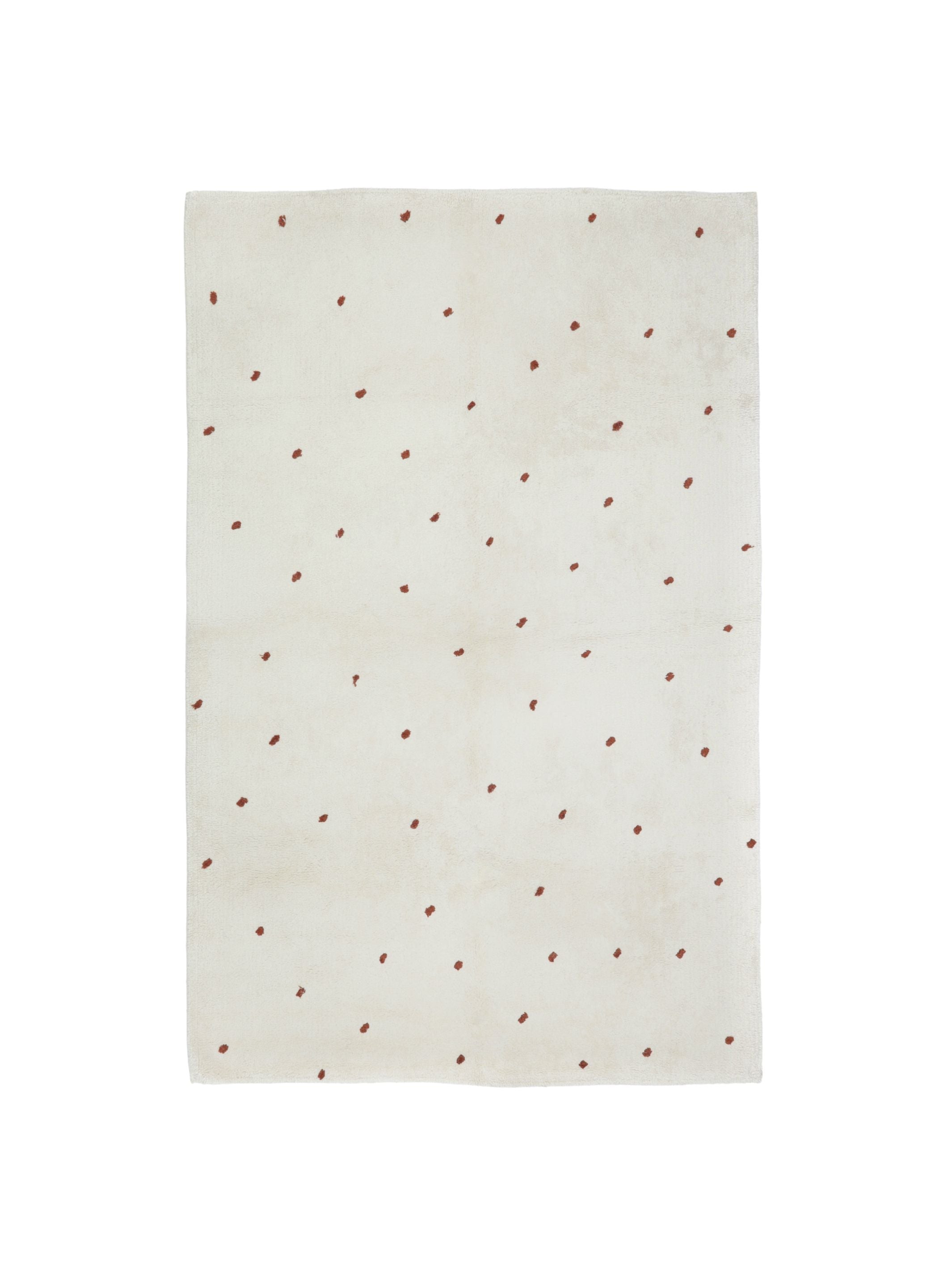 Natural rug with rust brown dot details