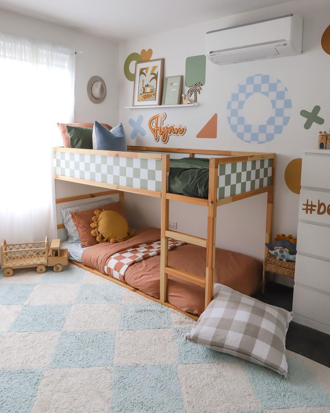 Colourful kids bedroom with bright blue checker rug