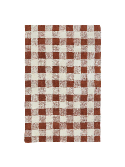 Natural rug with rust brown gingham details