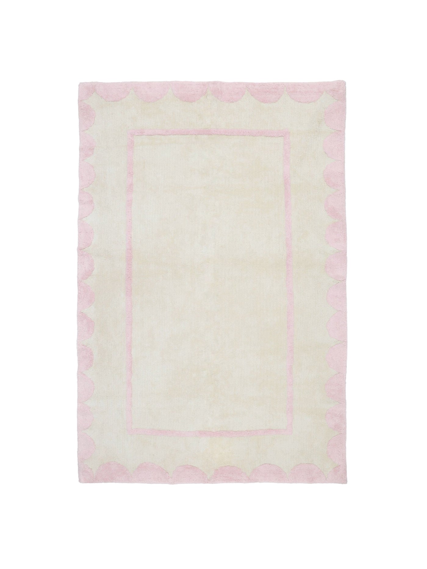 Natural rug with soft pink scallop details